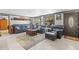 Inviting living room with plush seating, decorative accents, and views of the outdoors at 595 Denburn Ct, Englewood, FL 34223