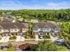 Aerial view of townhomes, featuring well-maintained landscaping and community parking at 602 Cabernet Way, Oldsmar, FL 34677