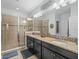 Bathroom features double sinks with granite counters and oversized glass enclosed shower at 602 Cabernet Way, Oldsmar, FL 34677