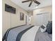 Comfortable bedroom with a ceiling fan, TV, and closet for storage at 602 Cabernet Way, Oldsmar, FL 34677