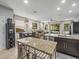 Open kitchen and living area, perfect for entertaining with an outside view at 602 Cabernet Way, Oldsmar, FL 34677