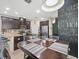 Spacious kitchen area with stainless steel appliances and dark cabinetry at 602 Cabernet Way, Oldsmar, FL 34677