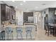 Open concept Kitchen with stainless steel appliances and an eat-in island with bar stool seating at 602 Cabernet Way, Oldsmar, FL 34677