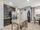 Kitchen with stainless steel refrigerator and granite countertop island at 602 Cabernet Way, Oldsmar, FL 34677