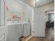 Laundry area with a new washer and dryer set and a shelving unit at 602 Cabernet Way, Oldsmar, FL 34677