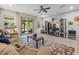 Cozy living room featuring a comfortable sectional sofa and a sliding glass door to the patio at 602 Cabernet Way, Oldsmar, FL 34677