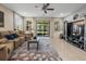 Comfortable living room with a plush sofa and a sliding glass door leading to an outdoor space at 602 Cabernet Way, Oldsmar, FL 34677