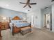 Beautiful bedroom features stylish furniture, coastal decor and neutral color scheme at 602 Cabernet Way, Oldsmar, FL 34677