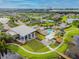 Aerial view of a large community with a recreation center, pool, ponds and walkways at 6326 Waves End Pl, Apollo Beach, FL 33572