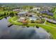 Aerial view of a large community with a recreation center, pool, pond and pier at 6326 Waves End Pl, Apollo Beach, FL 33572