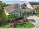 Aerial view of a well-maintained single-story home with a beautiful lawn and a two-car garage at 6326 Waves End Pl, Apollo Beach, FL 33572