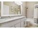 Bathroom featuring a double sink granite vanity and shower/tub combo at 6326 Waves End Pl, Apollo Beach, FL 33572