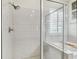 Bathroom shower with white subway tile and a glass door, adjacent to a soaking tub at 6326 Waves End Pl, Apollo Beach, FL 33572