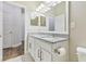Bathroom with double sinks with granite counters and modern fixtures at 6326 Waves End Pl, Apollo Beach, FL 33572