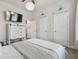 Bright bedroom with white furniture, providing a relaxing retreat with a view of the space at 6326 Waves End Pl, Apollo Beach, FL 33572