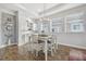 Cozy dining area with a modern chandelier and a decorative bar area at 6326 Waves End Pl, Apollo Beach, FL 33572