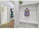 Welcoming entryway with custom bench and shelving, adding functional storage and charm to the home at 6326 Waves End Pl, Apollo Beach, FL 33572