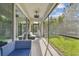 Relaxing screened-in lanai with cozy furniture and a peaceful view at 6326 Waves End Pl, Apollo Beach, FL 33572