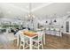 Open floor plan showcasing the living room, dining area, and kitchen with modern appliances at 6326 Waves End Pl, Apollo Beach, FL 33572