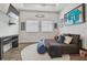 A modern living room is centered around relaxation with a flat-screen TV and cozy seating arrangements at 6326 Waves End Pl, Apollo Beach, FL 33572
