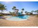 Resort style pool and water slides with many palm trees in the community at 6326 Waves End Pl, Apollo Beach, FL 33572