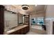 Spacious Primary bathroom featuring double sinks, vanity, soaking tub, and natural light at 6533 Channelside Dr, New Port Richey, FL 34652