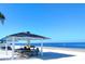 Beach pavilion with picnic tables on a sunny day overlooking the water at 6533 Channelside Dr, New Port Richey, FL 34652