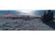 Sandcastle and chair on a sunny beach with sparkling ocean in the background at 6533 Channelside Dr, New Port Richey, FL 34652