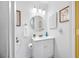 Cozy bathroom featuring a white single vanity, framed art, and classic fixtures at 6920 Lafayette N # 6920, Pinellas Park, FL 33781