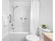 Bright bathroom featuring a tub/shower combo and classic fixtures at 6920 Lafayette N # 6920, Pinellas Park, FL 33781