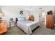 A bedroom with a bed, end tables, and a doorway to the bathroom at 6920 Lafayette N # 6920, Pinellas Park, FL 33781
