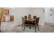 Bright dining area with a dining table for four and access to the kitchen at 6920 Lafayette N # 6920, Pinellas Park, FL 33781