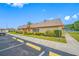Exterior of the building with well-maintained landscaping and dedicated parking at 6920 Lafayette N # 6920, Pinellas Park, FL 33781