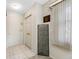 Light and airy hallway with neutral walls, tile flooring, and unique decorative accents at 6920 Lafayette N # 6920, Pinellas Park, FL 33781