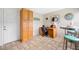 Bright open area featuring a work space, bar and a kitchen storage area with beautiful tile floors at 6920 Lafayette N # 6920, Pinellas Park, FL 33781