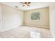 Bedroom featuring neutral walls, ceramic tile floors, a ceiling fan and a closet at 7303 E Bank Dr, Tampa, FL 33617