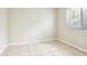 Bedroom with ceramic tile floors and a window at 7303 E Bank Dr, Tampa, FL 33617