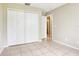 Bedroom featuring neutral walls, ceramic tile floors, and a closet at 7303 E Bank Dr, Tampa, FL 33617