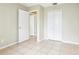 Bedroom featuring neutral walls, ceramic tile floors, and closet at 7303 E Bank Dr, Tampa, FL 33617