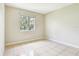 Bedroom with neutral walls and ceramic tile floors, offering a clean space at 7303 E Bank Dr, Tampa, FL 33617