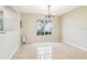 Bright dining room with large window and tile flooring at 7303 E Bank Dr, Tampa, FL 33617