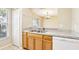 Kitchen pass-through to dining room at 7303 E Bank Dr, Tampa, FL 33617