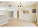 Spacious living room leading to kitchen area with tile flooring at 7303 E Bank Dr, Tampa, FL 33617