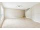 Open living space featuring tile flooring, a ceiling fan, and a staircase to the upper level at 7303 E Bank Dr, Tampa, FL 33617