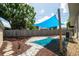 Spacious backyard featuring a patio area with stylish shade sail, perfect for outdoor relaxation at 8031 7Th N St, St Petersburg, FL 33702