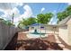 Backyard with shade sails offers a private oasis for outdoor enjoyment and entertainment at 8031 7Th N St, St Petersburg, FL 33702