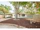Charming single-story home with a covered carport, mature tree, and well-maintained front yard at 8031 7Th N St, St Petersburg, FL 33702