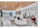 Open-concept dining and living areas with stained glass windows and lots of seating at 8031 7Th N St, St Petersburg, FL 33702