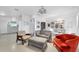 Open-concept living space with stylish furnishings and an adjacent kitchen area at 8031 7Th N St, St Petersburg, FL 33702
