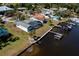 Waterfront home featuring a screened lanai, private dock, and lush landscaping, perfect for enjoying waterfront living at 828 Bayshore Dr, Tarpon Springs, FL 34689